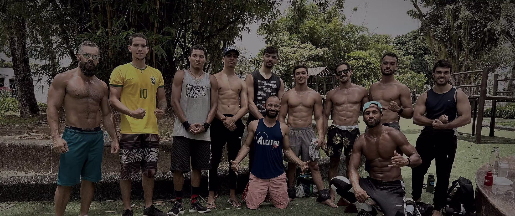Group of calisthenics athletes at an outdoor workout park